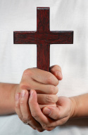 hands-holding-a-cross